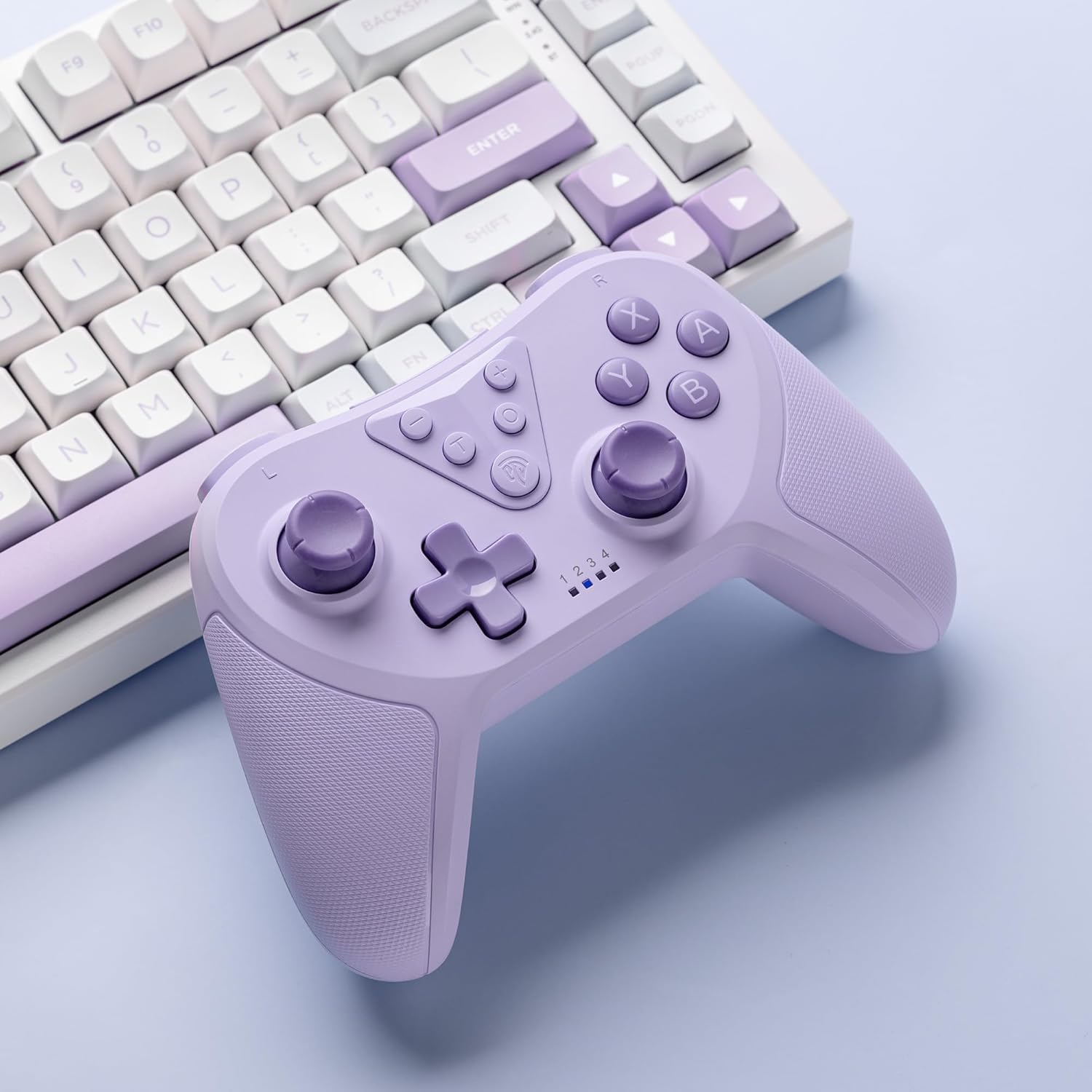 Easysmx t37 Purple gaming controller and keyboard on a light blue background