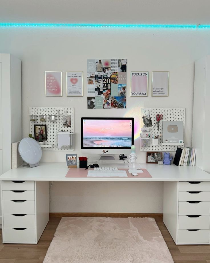 Modern home office with a white desk, computer setup, and decorative elements.