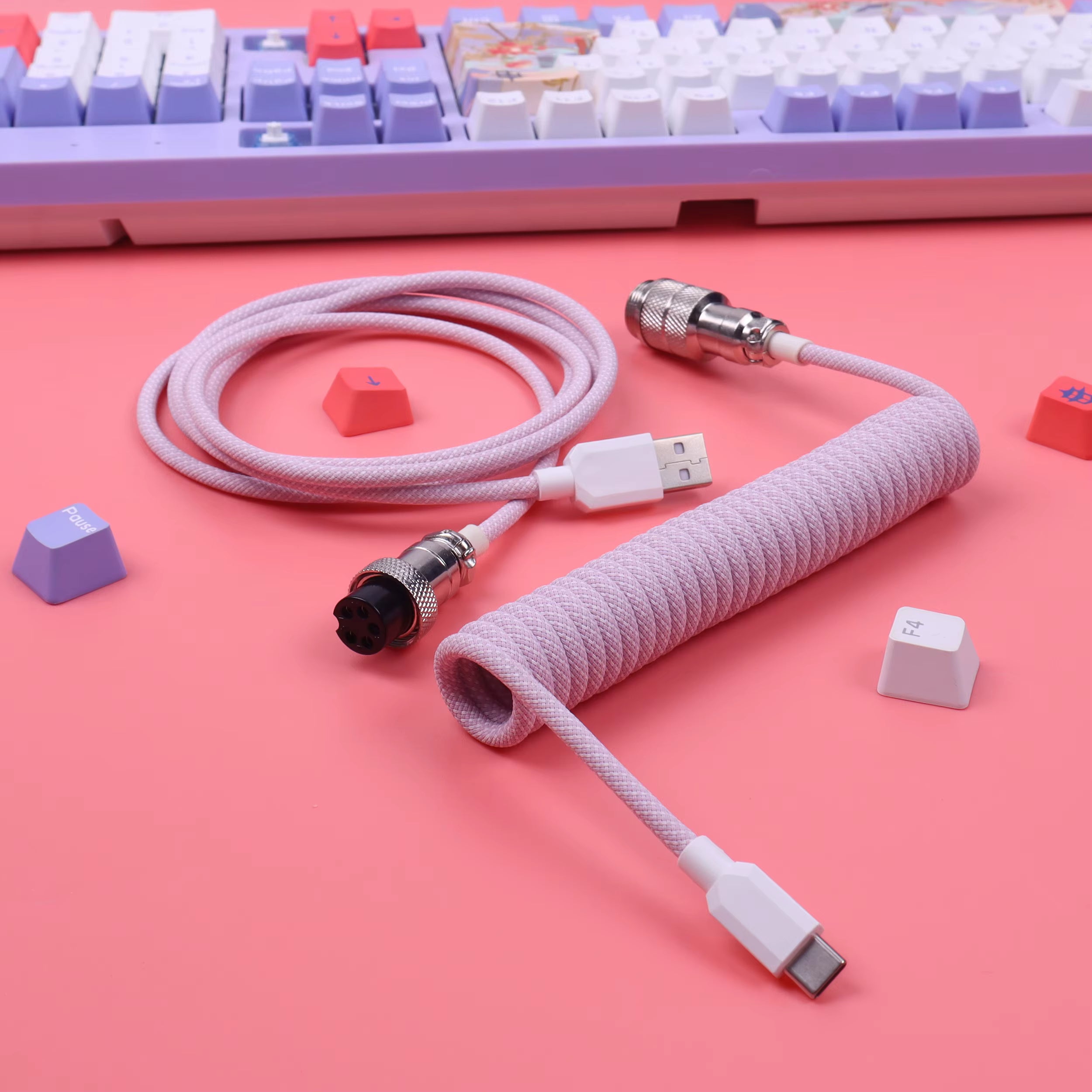 Macaron Pink braided cable with connectors on a pink background